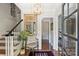 Elegant foyer showcasing staircase, stylish decor, and access to other living spaces at 6409 Ilex Ct, Charlotte, NC 28211