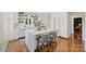 Bright, modern kitchen with white cabinetry, quartz countertops and stainless steel appliances at 6409 Ilex Ct, Charlotte, NC 28211