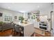 Bright kitchen with an island, stainless steel appliances, and hardwood floors at 6409 Ilex Ct, Charlotte, NC 28211