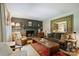 Comfortable living room featuring a fireplace and decorative mirror at 6409 Ilex Ct, Charlotte, NC 28211