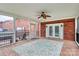 A screened-in back porch features an outdoor ceiling fan at 6908 Lancer Dr, Charlotte, NC 28226