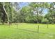 Spacious backyard offers a serene and private outdoor retreat surrounded by lush greenery and mature trees at 6908 Lancer Dr, Charlotte, NC 28226