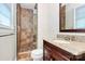 Bathroom with tile shower, granite vanity and stylish design elements at 6908 Lancer Dr, Charlotte, NC 28226