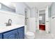 This bathroom features a blue vanity at 6908 Lancer Dr, Charlotte, NC 28226