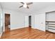 Hardwood bedroom with closet, ceiling fan and an ensuite bathroom at 6908 Lancer Dr, Charlotte, NC 28226