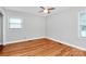 Inviting bedroom with hardwood floors, a ceiling fan, and ample natural light at 6908 Lancer Dr, Charlotte, NC 28226