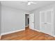 This bedroom features hardwood floors and a closet at 6908 Lancer Dr, Charlotte, NC 28226