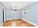 Empty dining room showcasing hardwood floors and a stylish chandelier at 6908 Lancer Dr, Charlotte, NC 28226
