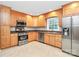 Modern kitchen featuring stainless steel appliances and light wood cabinetry at 6908 Lancer Dr, Charlotte, NC 28226