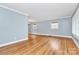 Spacious living room with gleaming hardwood floors and ample natural light at 6908 Lancer Dr, Charlotte, NC 28226