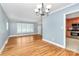 Inviting living space with hardwood floors and an open view to the kitchen at 6908 Lancer Dr, Charlotte, NC 28226