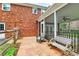 Patio boasts stamped concrete, outdoor furniture, and a fenced yard with lush greenery at 6908 Lancer Dr, Charlotte, NC 28226