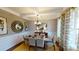 Elegant dining room with coffered ceilings, stylish lighting, and ample space for entertaining guests at 7101 Butternut Oak Ter, Huntersville, NC 28078