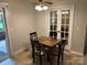 Cozy dining area featuring a classic table set and access to the back patio through French doors at 7316 Truelight Church Rd, Mint Hill, NC 28227