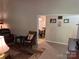 Open-concept living area with a view into the dining room, showcasing a relaxed and connected space at 7316 Truelight Church Rd, Mint Hill, NC 28227