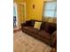 Comfortable living room featuring a cozy sofa, hardwood flooring and bright yellow walls at 7316 Truelight Church Rd, Mint Hill, NC 28227