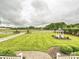 Expansive lawns and white fenced pastures surround this property with a gazebo at 735 Davidson Run Ln, Davidson, NC 28036