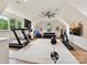 Bright and airy home gym with modern equipment, ceiling fan, and ample natural light at 735 Davidson Run Ln, Davidson, NC 28036