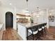 Bright kitchen features gray counters, stainless appliances, marble backsplash, and black door at 735 Davidson Run Ln, Davidson, NC 28036