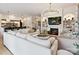 Spacious living room with a fireplace, comfortable seating, and open layout to kitchen at 735 Davidson Run Ln, Davidson, NC 28036