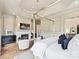 Elegant main bedroom featuring a fireplace, canopy bed, and stylish decor at 735 Davidson Run Ln, Davidson, NC 28036