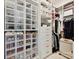 Organized walk-in closet with custom shelving, drawers, and ample storage space at 735 Davidson Run Ln, Davidson, NC 28036