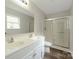 Bathroom featuring double sink vanity and shower with sliding glass door at 737 Lynville Ln, Rock Hill, SC 29730