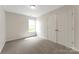 Bedroom featuring neutral carpeting, closet, and a large window at 737 Lynville Ln, Rock Hill, SC 29730