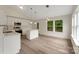 Bright kitchen featuring white cabinetry, an island, and stainless steel appliances at 737 Lynville Ln, Rock Hill, SC 29730