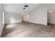Bright living room featuring vaulted ceiling, ceiling fan, and attractive wood-look flooring at 737 Lynville Ln, Rock Hill, SC 29730
