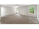 Spacious main bedroom featuring neutral carpeting and a ceiling fan at 737 Lynville Ln, Rock Hill, SC 29730