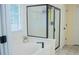 Bright bathroom features a soaking tub and walk-in shower at 7708 Harrington Woods Rd, Charlotte, NC 28269