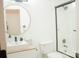Modern bathroom with walk-in shower and stylish round mirror at 7708 Harrington Woods Rd, Charlotte, NC 28269