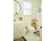 Bright bathroom with white vanity, toilet, shower, and decor at 7708 Harrington Woods Rd, Charlotte, NC 28269