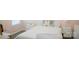 Comfortable bedroom with bed, side tables, and ample natural light at 7708 Harrington Woods Rd, Charlotte, NC 28269
