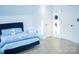 Bedroom featuring hardwood floors, modern decor, and great lighting at 7708 Harrington Woods Rd, Charlotte, NC 28269
