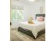 Bright bedroom with neutral tones and large windows offers a cozy retreat at 7708 Harrington Woods Rd, Charlotte, NC 28269