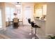 Bright dining area with table, seating, and access to the kitchen and pantry at 7708 Harrington Woods Rd, Charlotte, NC 28269