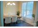 Dining room featuring a modern chandelier and seating for six with natural light at 7708 Harrington Woods Rd, Charlotte, NC 28269