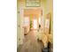 Inviting foyer featuring laminate floors, modern decor, and a view to the living area at 7708 Harrington Woods Rd, Charlotte, NC 28269