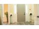 Stylish front door with sidelights and decorative floral arrangements at 7708 Harrington Woods Rd, Charlotte, NC 28269
