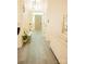 Inviting hallway showcasing light-colored walls and flooring at 7708 Harrington Woods Rd, Charlotte, NC 28269