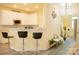 Kitchen featuring white cabinets, countertops, and barstool seating at 7708 Harrington Woods Rd, Charlotte, NC 28269