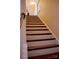 A clear, close up view of the wooden staircase of the home at 7708 Harrington Woods Rd, Charlotte, NC 28269