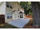 The back of the home shows sliding doors to the backyard and a well-maintained patio area for entertaining at 7830 Shiny Meadow Ln, Charlotte, NC 28215