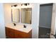 Bathroom featuring dual sinks and a stand up shower at 7830 Shiny Meadow Ln, Charlotte, NC 28215