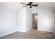 Bedroom featuring neutral color scheme and ceiling fan at 7830 Shiny Meadow Ln, Charlotte, NC 28215