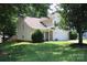 Charming two-story home features a well-maintained lawn, attached two-car garage, and attractive landscaping at 7830 Shiny Meadow Ln, Charlotte, NC 28215