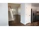 Open-concept living room featuring stairs to the second floor at 7830 Shiny Meadow Ln, Charlotte, NC 28215