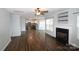 Spacious living room featuring a fireplace and open floor plan to the kitchen at 7830 Shiny Meadow Ln, Charlotte, NC 28215